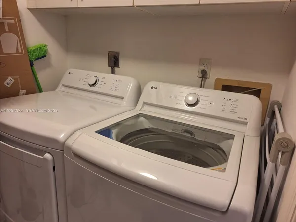 a utility room with dryer and washer