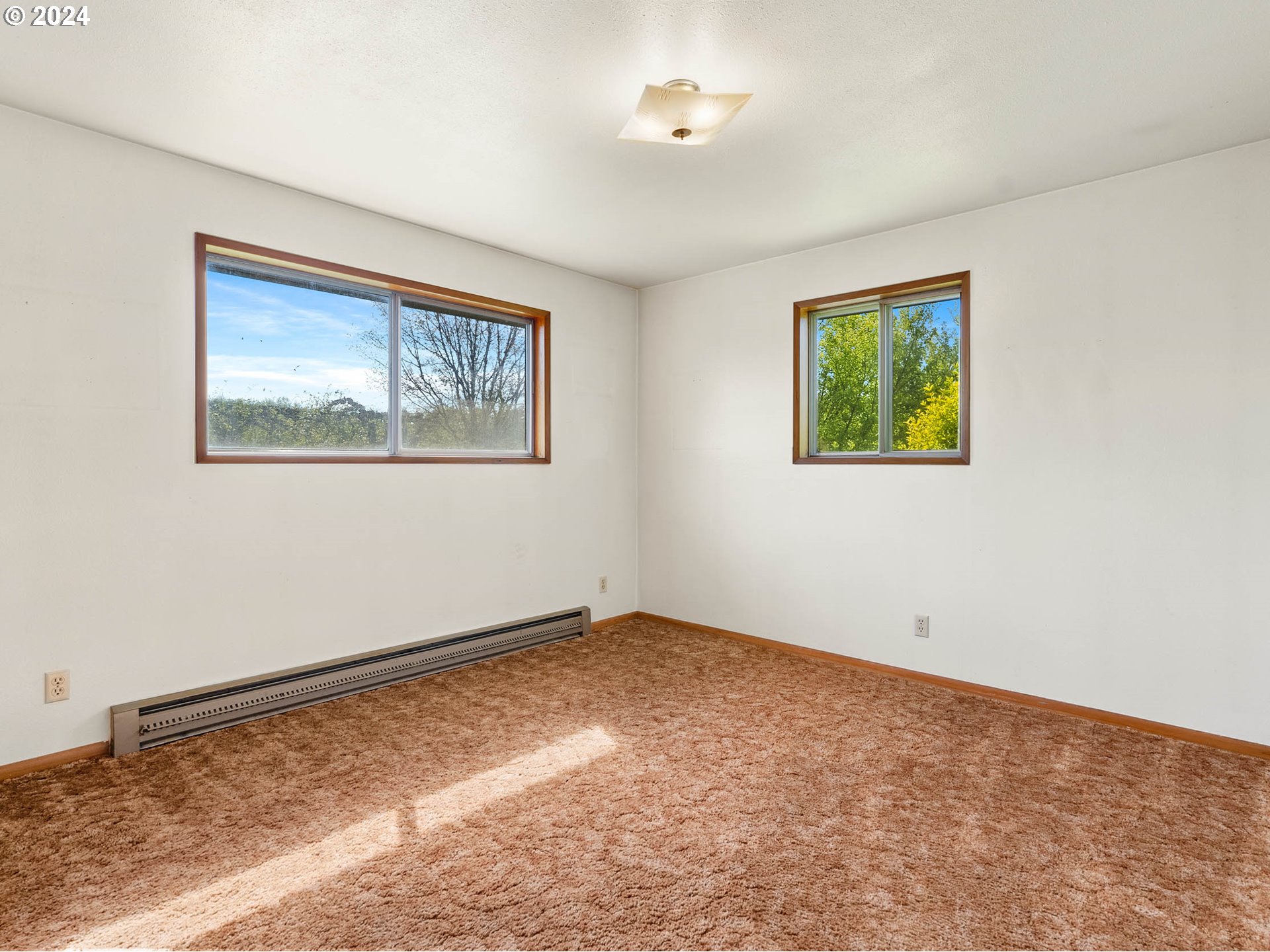 23865 Southwest Tile Flat Road Hillsboro, OR 97123 - Photo 18 of 36 a view of an empty room with a window
