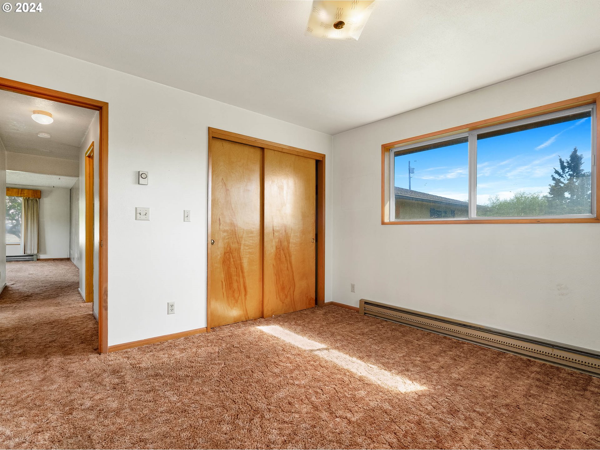 23865 Southwest Tile Flat Road Hillsboro, OR 97123 - Photo 19 of 36 an empty room with a wooden door