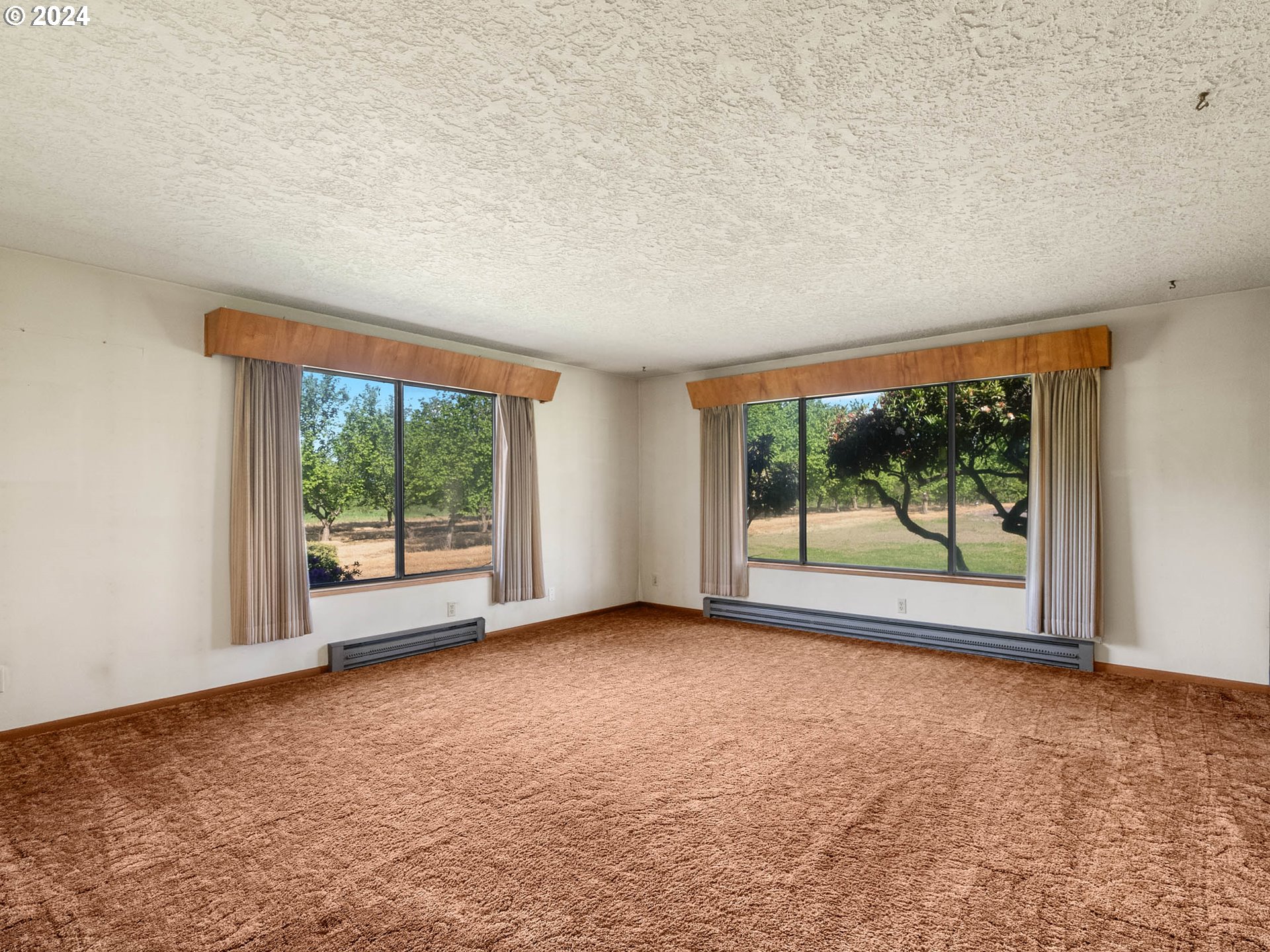 23865 Southwest Tile Flat Road Hillsboro, OR 97123 - Photo 7 of 36 an empty room with large windows