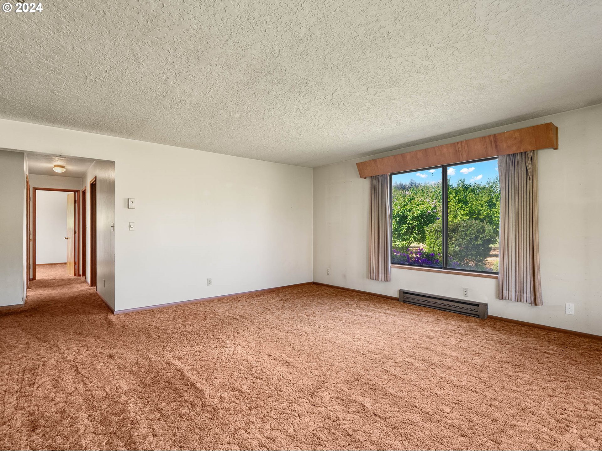 23865 Southwest Tile Flat Road Hillsboro, OR 97123 - Photo 8 of 36 a view of an empty room with a window