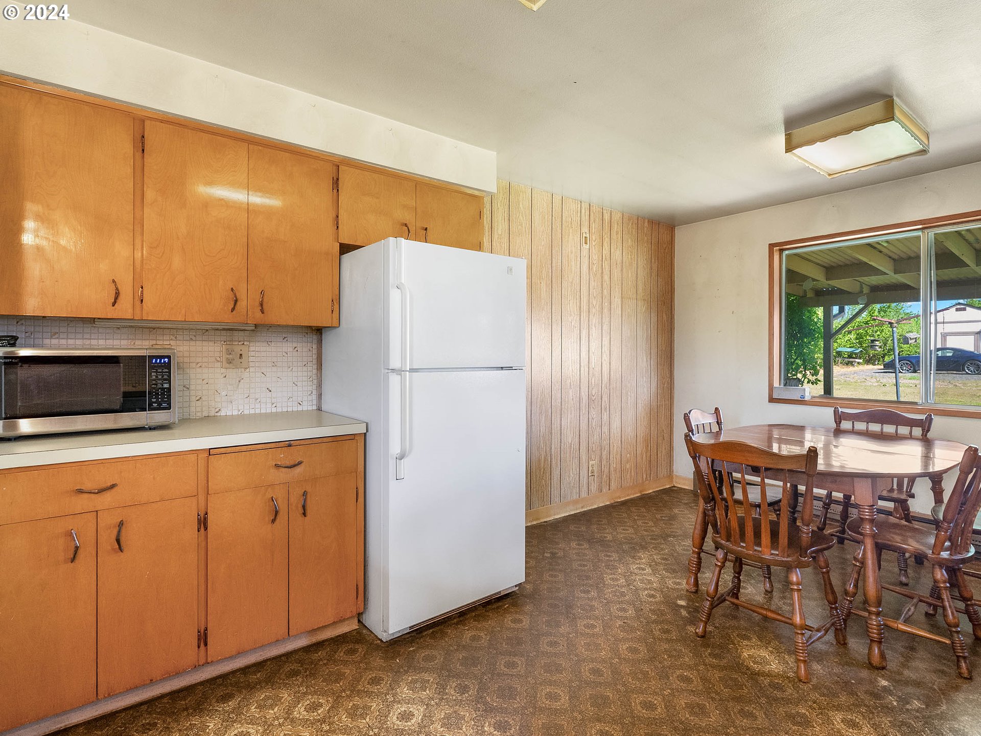 23865 Southwest Tile Flat Road Hillsboro, OR 97123 - Photo 10 of 36 a kitchen with a refrigerator a stove a sink and a cabinets