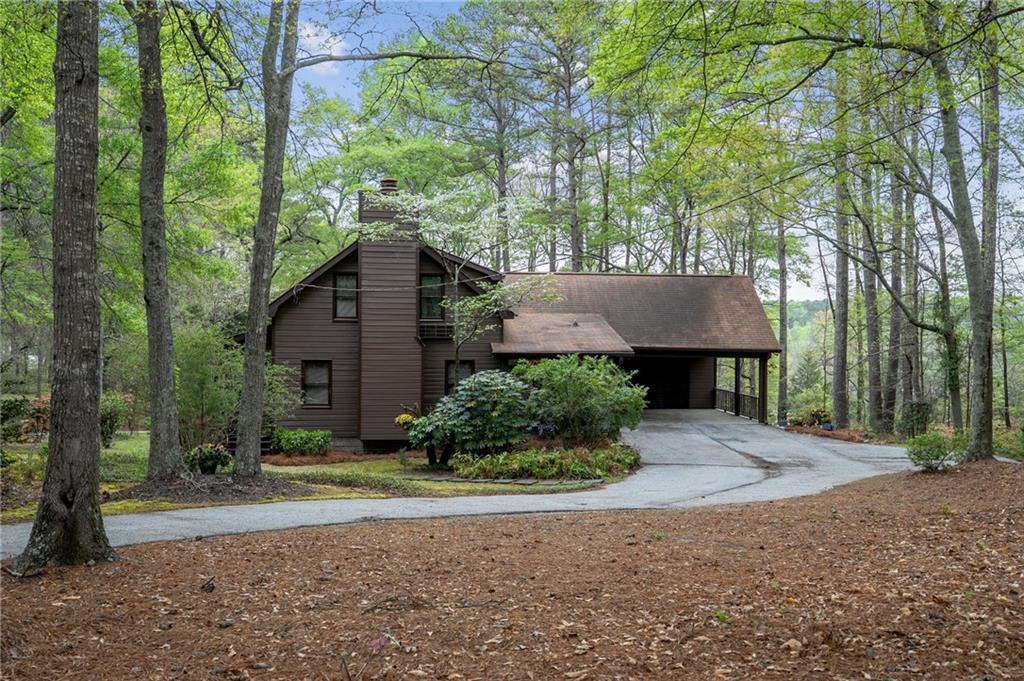 3121 Bonds Lake Road Northwest Conyers, GA 30012 - Photo 5 of 36 front view of a house with a yard