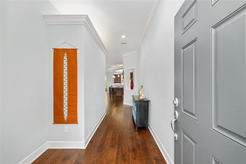 8942 Southwest 25 Road Gainesville, FL 32608 - Photo 15 of 22 a view of hallway with wooden floor