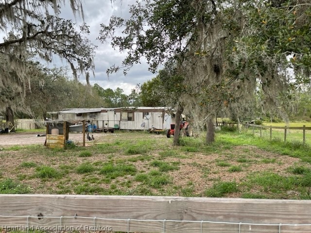 880 Otto Polk Road Frostproof, FL 33843 - Photo 3 of 3 a view of a yard with large trees