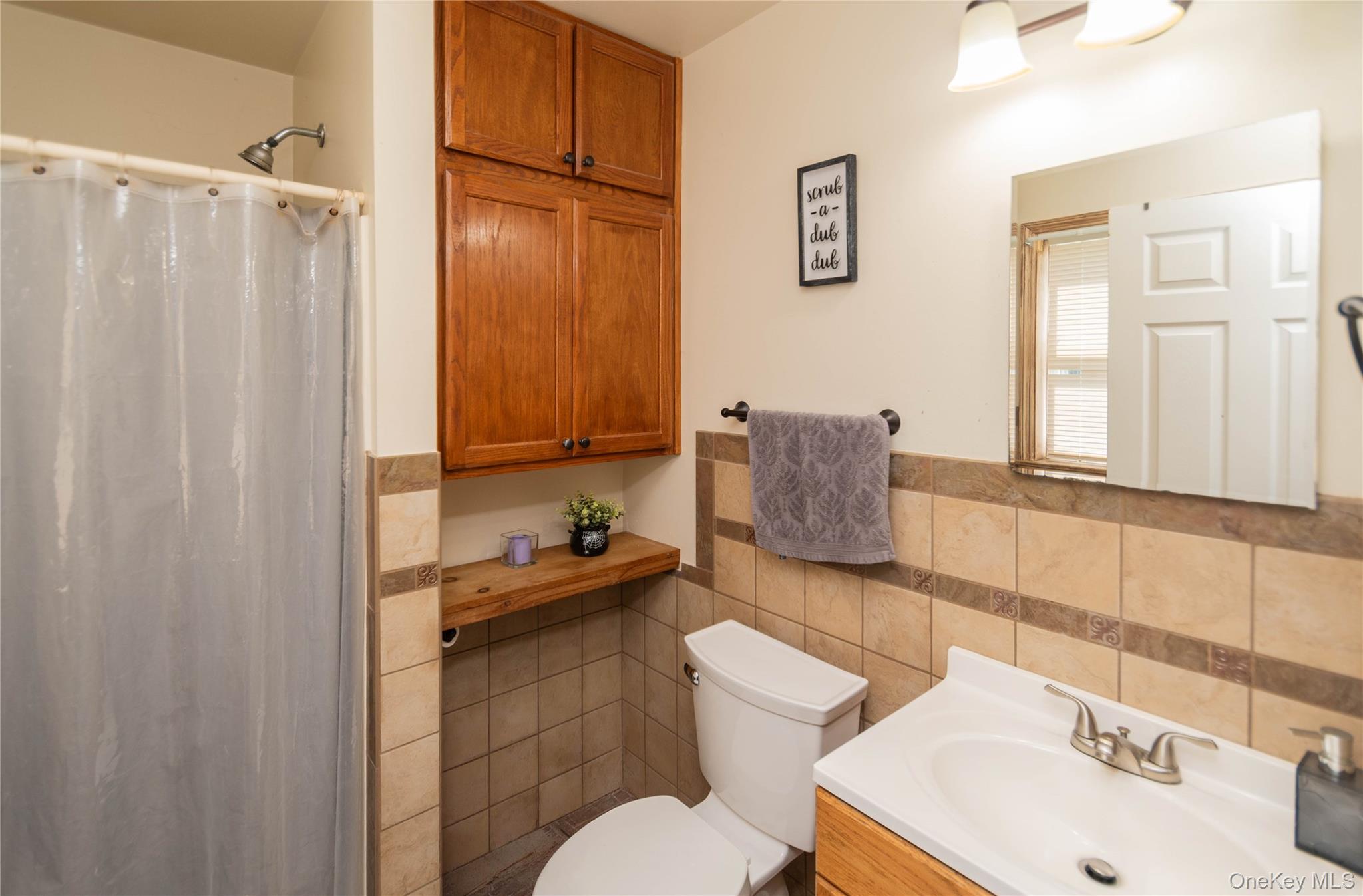 29 Murray Road Middletown, NY 10940 - Photo 9 of 24 a bathroom with a sink toilet and shower