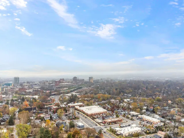 an aerial view of residential building and ocean view