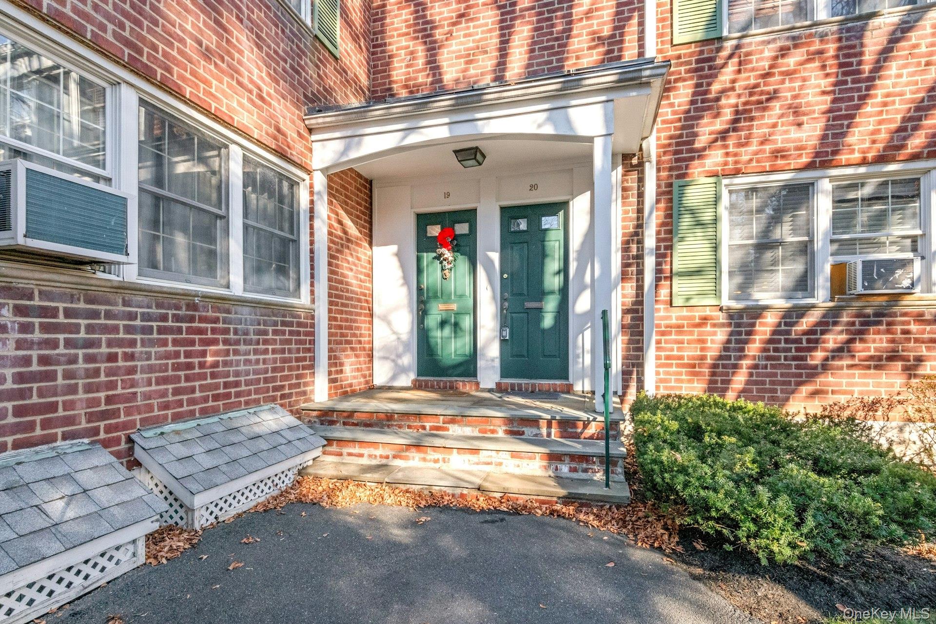 a view of front door of house with a outdoor space