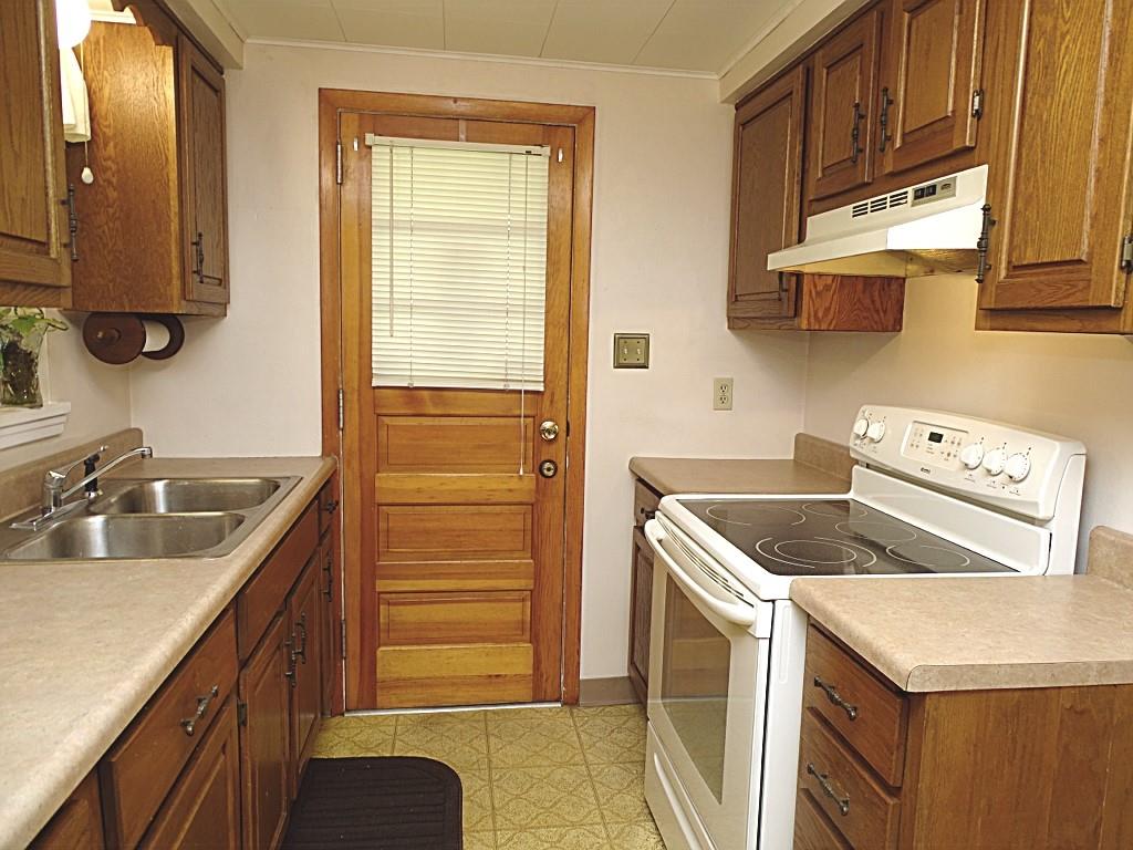 394 Rockhill Road Pittsburgh, PA 15243 - Photo 10 of 25 Galley kitchen with great storage, counterspace, door to deck (12x8)