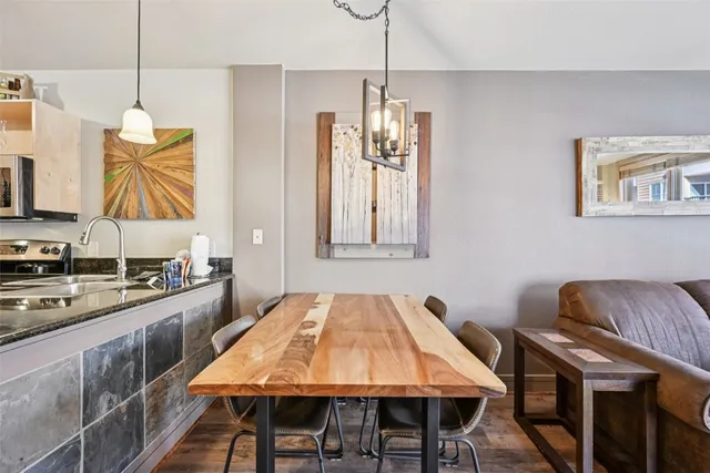 a dinning table and chairs in a kitchen