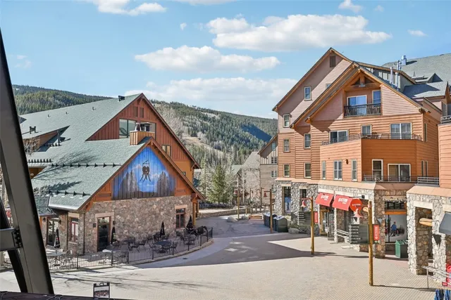 a front view of a residential houses with yard