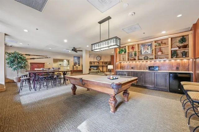 a living room with furniture a table and chairs