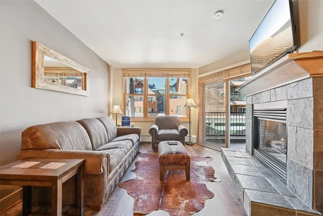 a living room with furniture fireplace and a flat screen tv