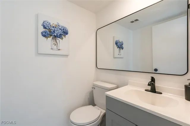 a bathroom with a toilet and a sink