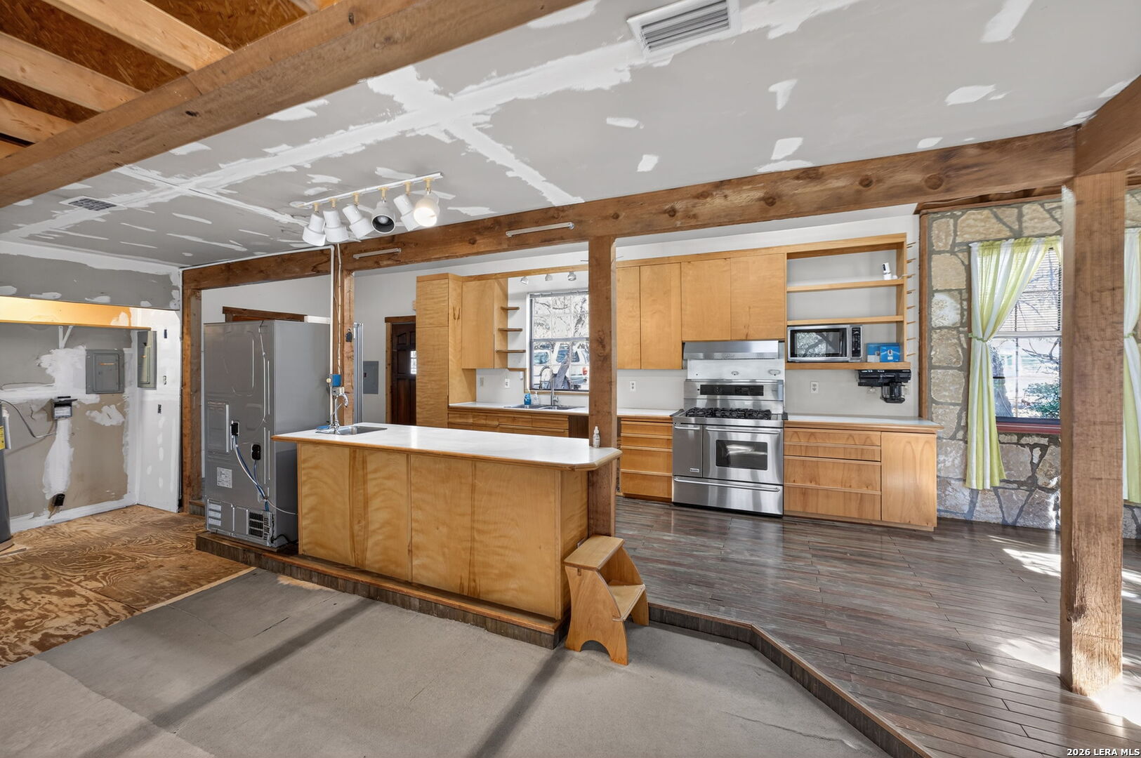 218 Whitworth Road Boerne, TX 78006 - Photo 9 of 26 a kitchen with stainless steel appliances granite countertop a stove and a refrigerator