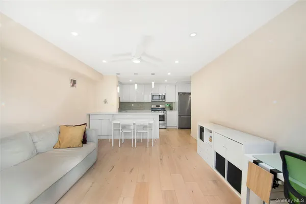 a kitchen with stainless steel appliances granite countertop a sink and cabinets
