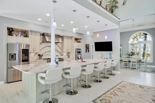 a view of a white house with a yard