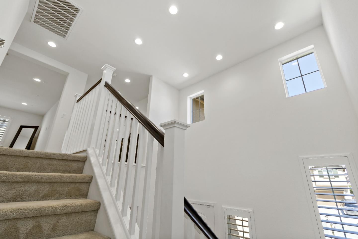 113 Willowrun Way Oakley, CA 94561 - Photo 12 of 63 a view of staircase with lots of frames and white walls