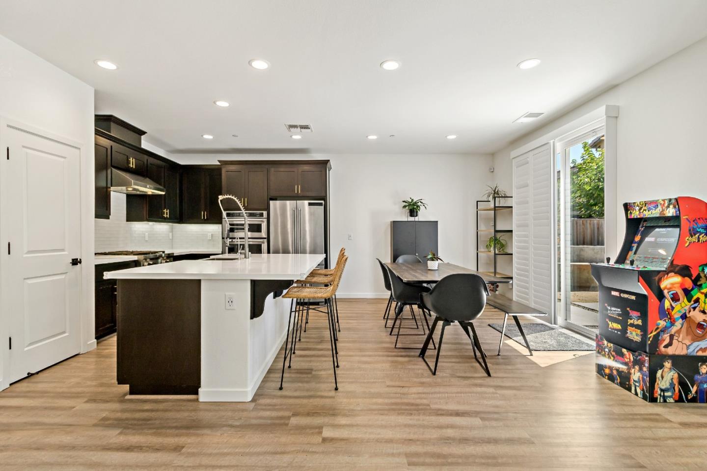 113 Willowrun Way Oakley, CA 94561 - Photo 21 of 63 a living room with stainless steel appliances kitchen island granite countertop furniture and a wooden floor