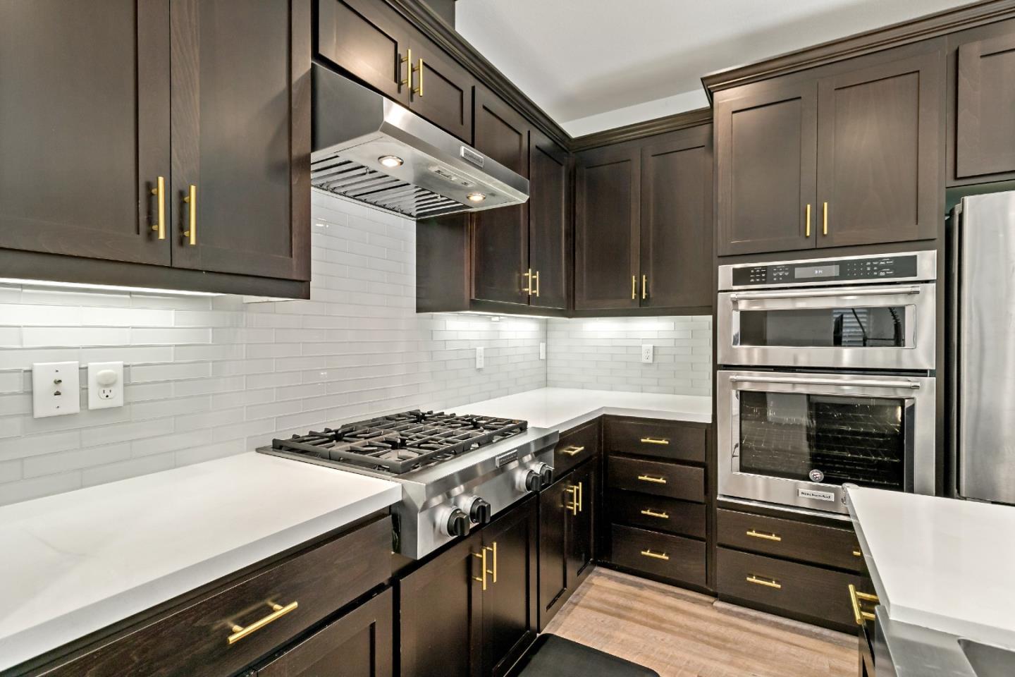 113 Willowrun Way Oakley, CA 94561 - Photo 24 of 63 a kitchen with stainless steel appliances a stove a sink and a refrigerator