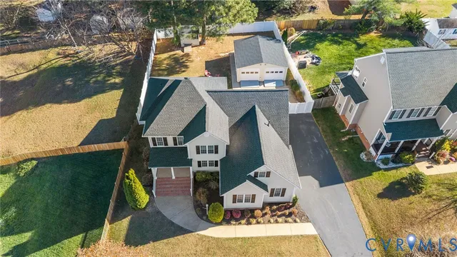 an aerial view of houses with outdoor space