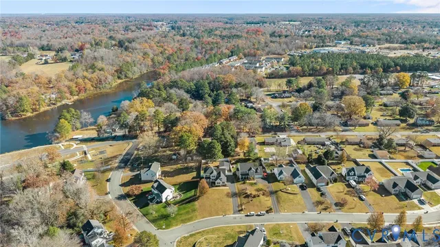 an aerial view of residential houses with outdoor space