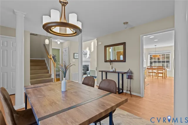 a view of a dining room with furniture and wooden floor