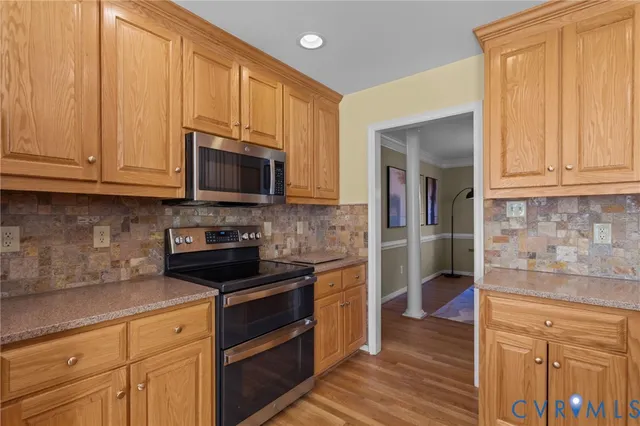 a kitchen with a stove and a microwave