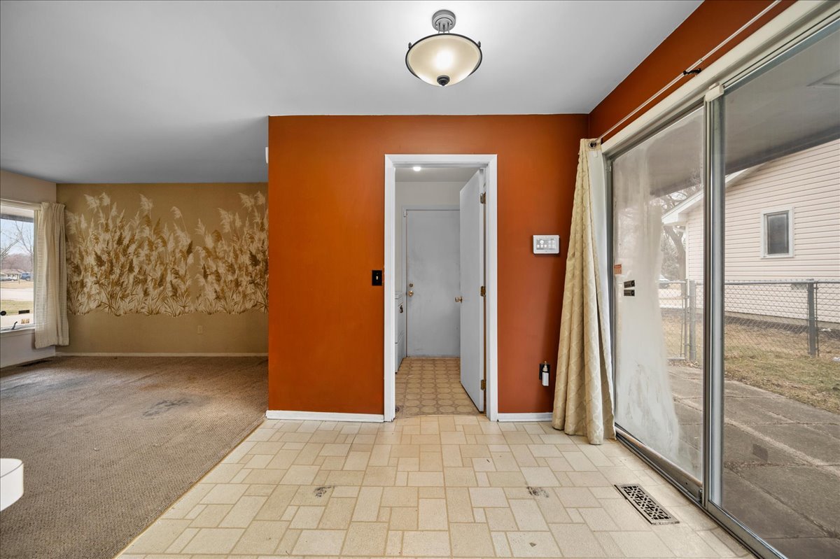 30 Somerset Road Montgomery, IL 60538 - Photo 7 of 30 an empty room with wooden floor and a large window