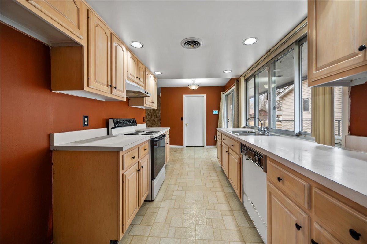 30 Somerset Road Montgomery, IL 60538 - Photo 9 of 30 a large kitchen with stainless steel appliances granite countertop a lot of counter space and a sink