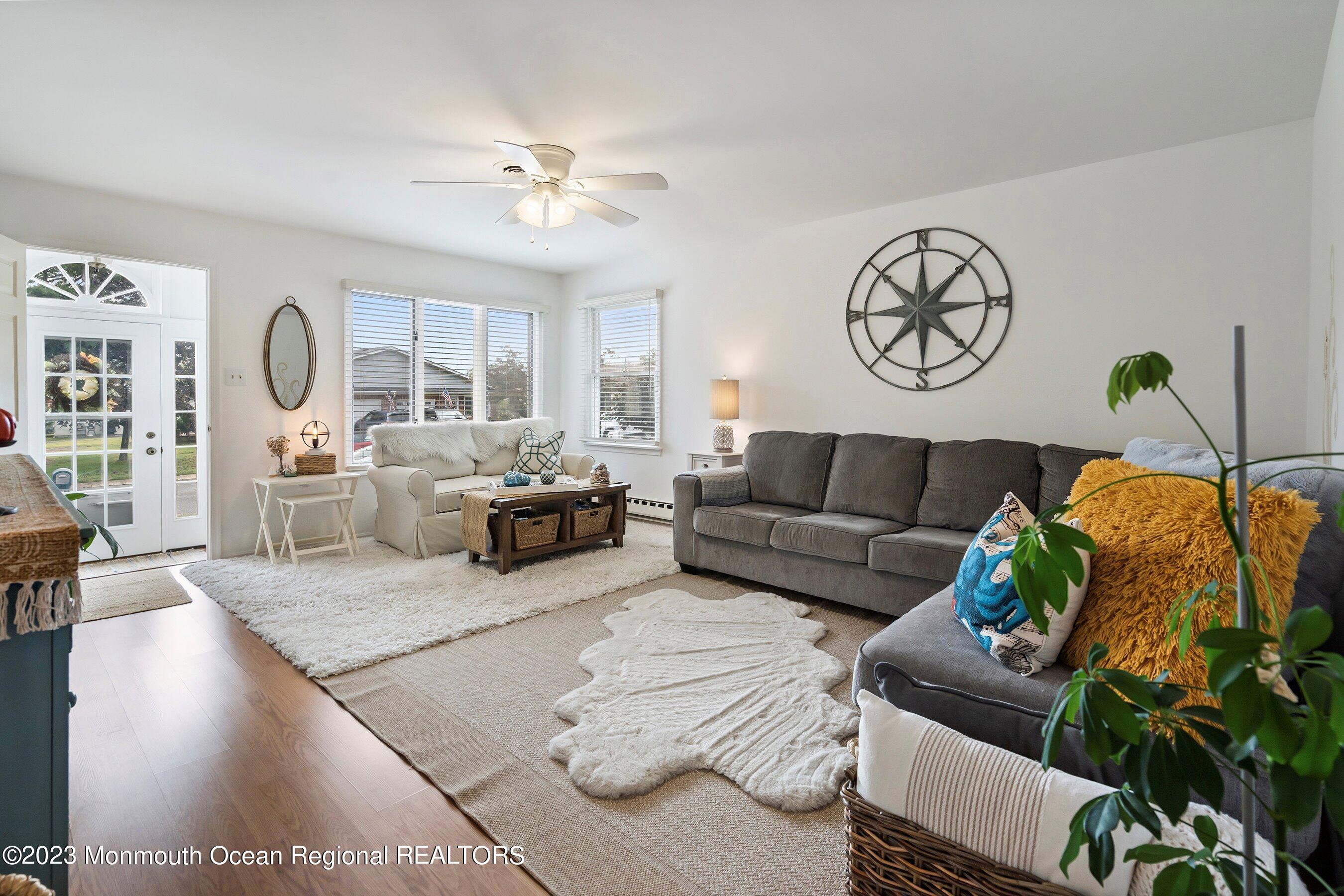 60 Sycamore Access Road, Unit 29 Manahawkin, NJ 08050 - Photo 2 of 24 a living room with furniture and a large window