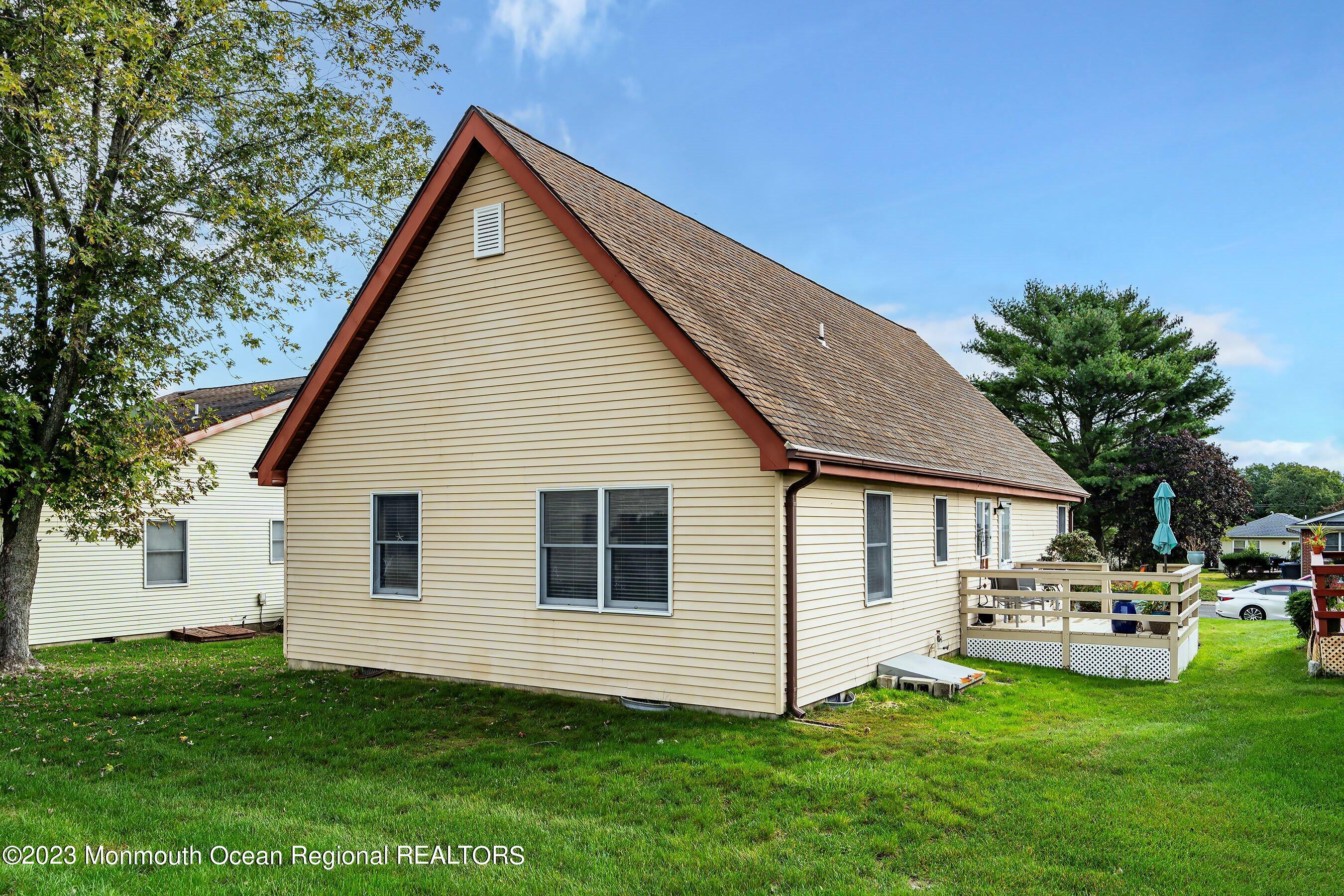 60 Sycamore Access Road, Unit 29 Manahawkin, NJ 08050 - Photo 23 of 24 a view of a house with a yard