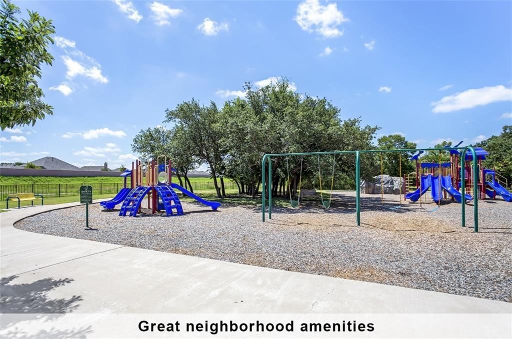 2109 Granite Springs Road Leander, TX 78641 - Photo 23 of 30 A community playground awaits with vibrant slides and swings for recreational enjoyment.