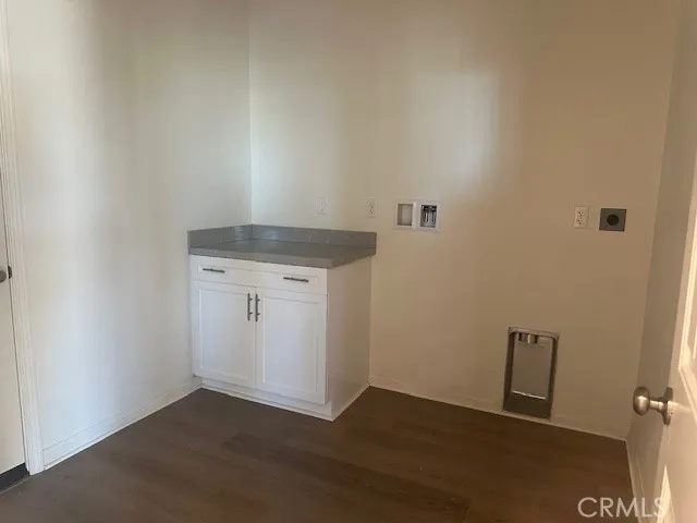 an empty room with wooden floor