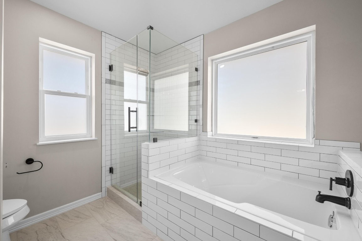 201 Young Ranch Road Georgetown, TX 78633 - Photo 19 of 40 a bathroom with a bathtub and a shower