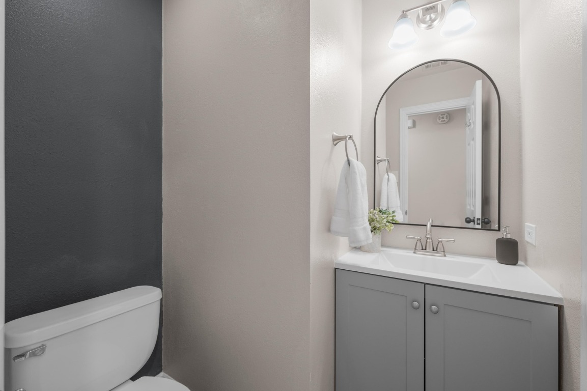 201 Young Ranch Road Georgetown, TX 78633 - Photo 24 of 40 a bathroom with a toilet sink and mirror