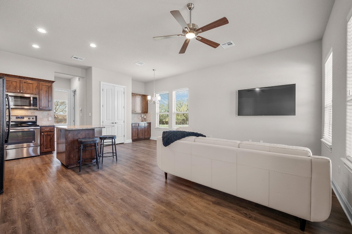 201 Young Ranch Road Georgetown, TX 78633 - Photo 28 of 40 a living room with furniture and a flat screen tv