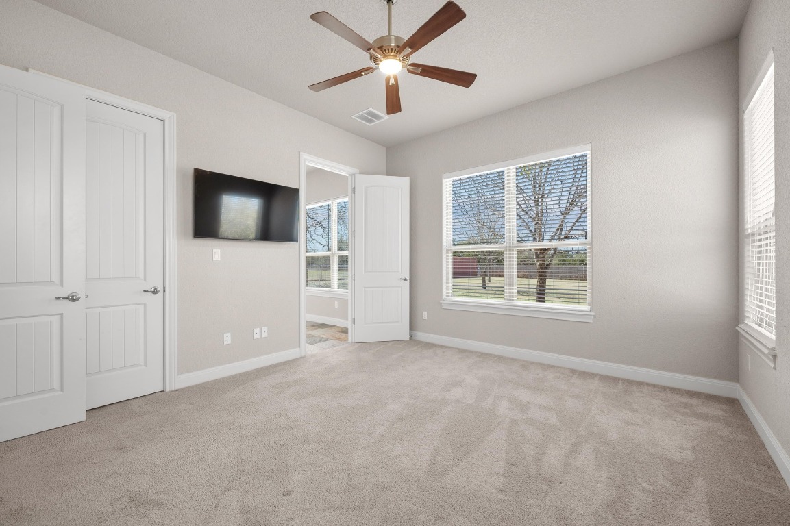 201 Young Ranch Road Georgetown, TX 78633 - Photo 31 of 40 a view of a livingroom with a ceiling fan and window