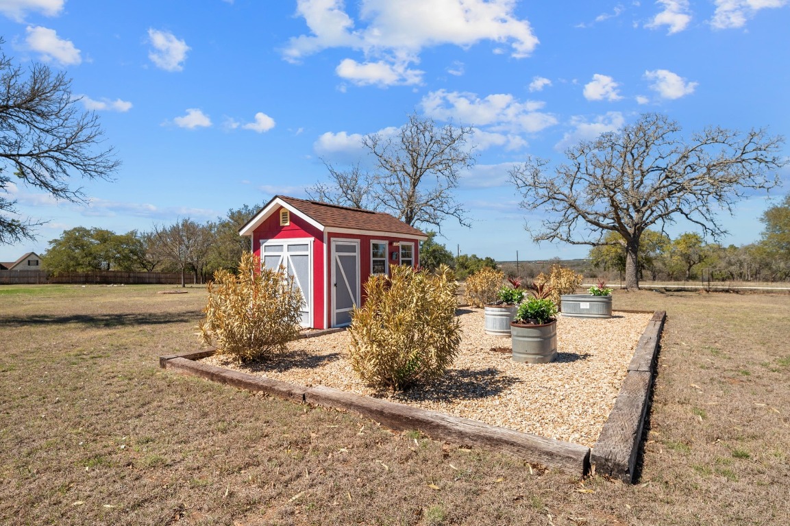 201 Young Ranch Road Georgetown, TX 78633 - Photo 35 of 40 a view of a house with backyard and sitting area