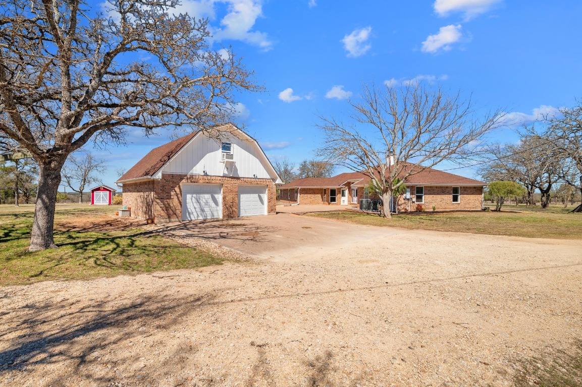 201 Young Ranch Road Georgetown, TX 78633 - Photo 36 of 40 a front view of a house with a yard