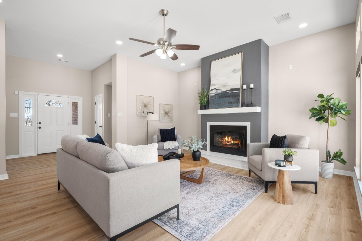 201 Young Ranch Road Georgetown, TX 78633 - Photo 4 of 40 a living room with furniture and a fireplace