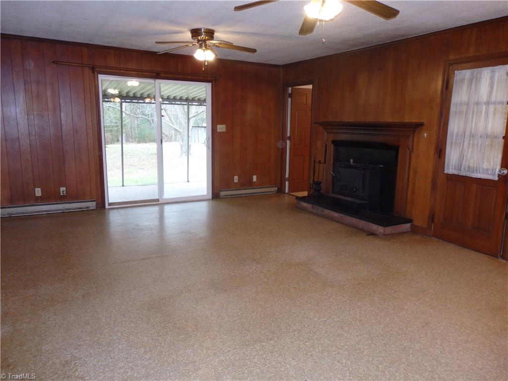 1018 Sutton Road Greensboro, NC 27406 - Photo 11 of 47 Den with door to covered back porch