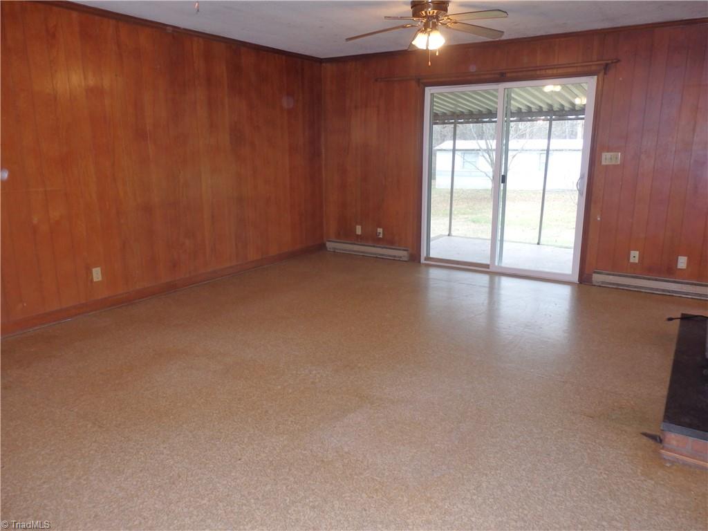 1018 Sutton Road Greensboro, NC 27406 - Photo 12 of 47 Den with door to outside covered porch.