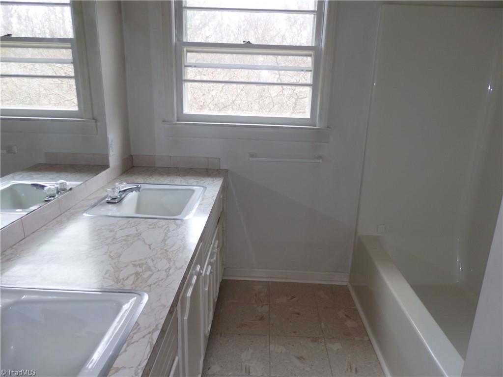 1018 Sutton Road Greensboro, NC 27406 - Photo 22 of 47 Bathroom with double vanity.