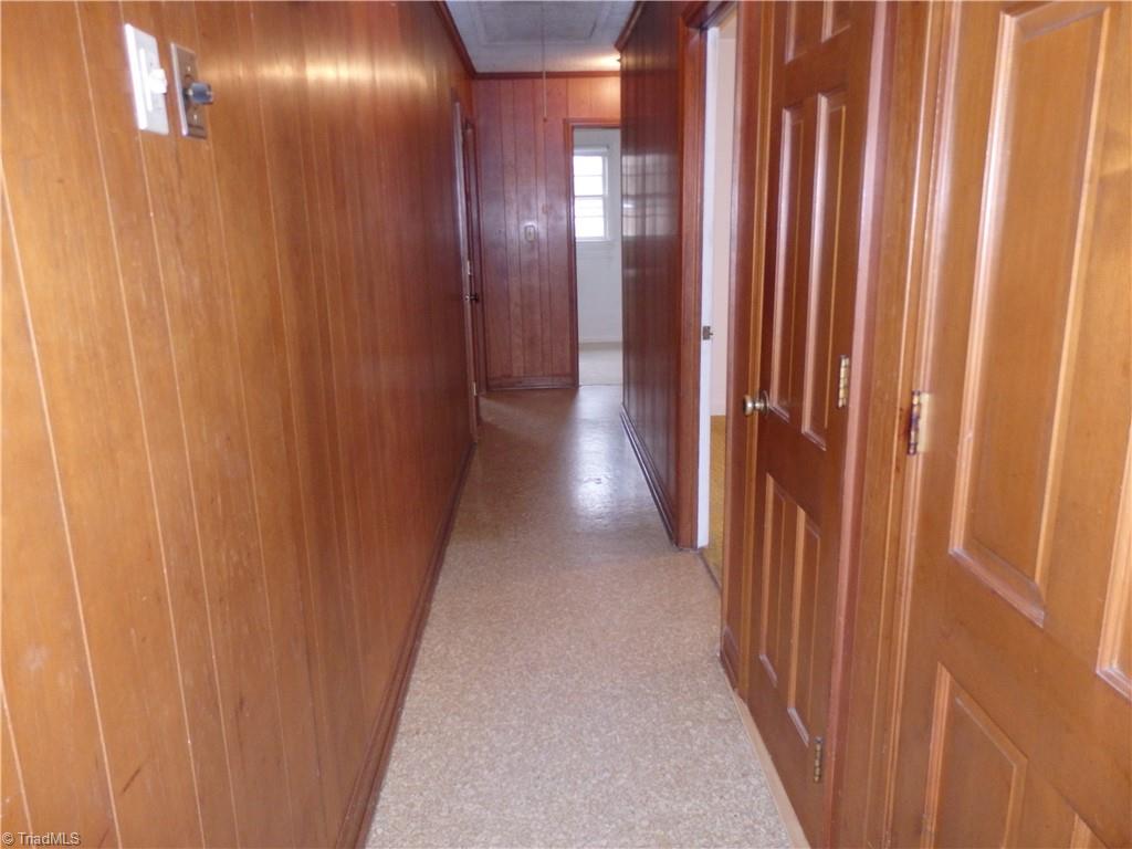 1018 Sutton Road Greensboro, NC 27406 - Photo 24 of 47 Hallway with entrance to basement.