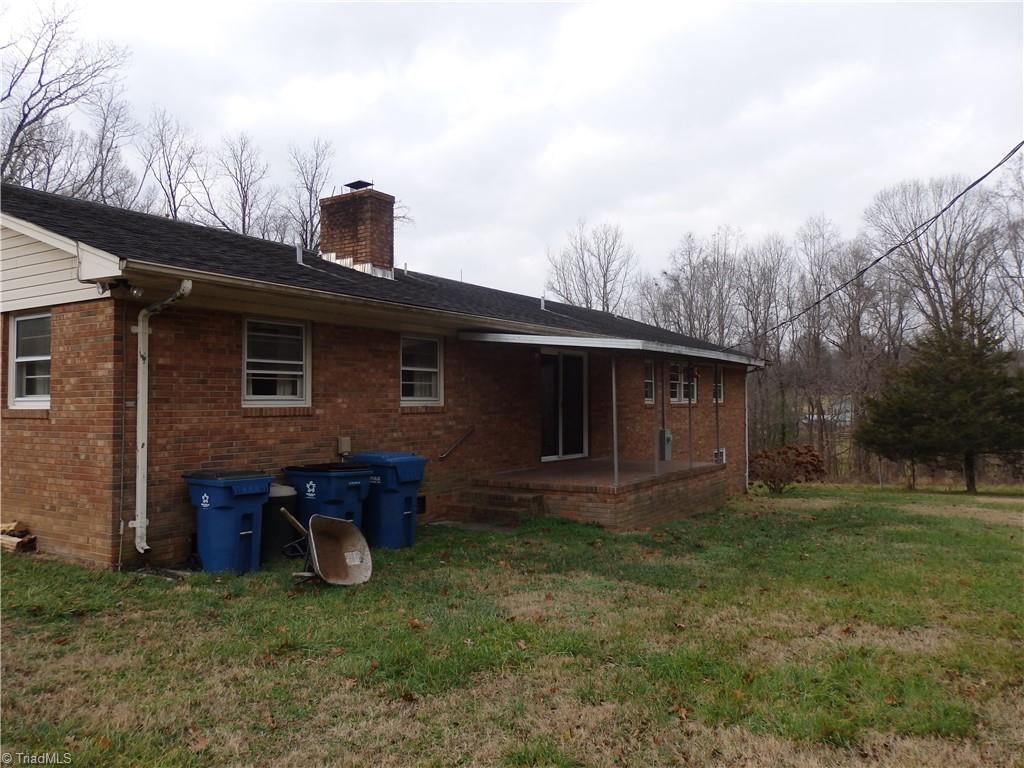1018 Sutton Road Greensboro, NC 27406 - Photo 4 of 47 Back of home with covered concrete porch