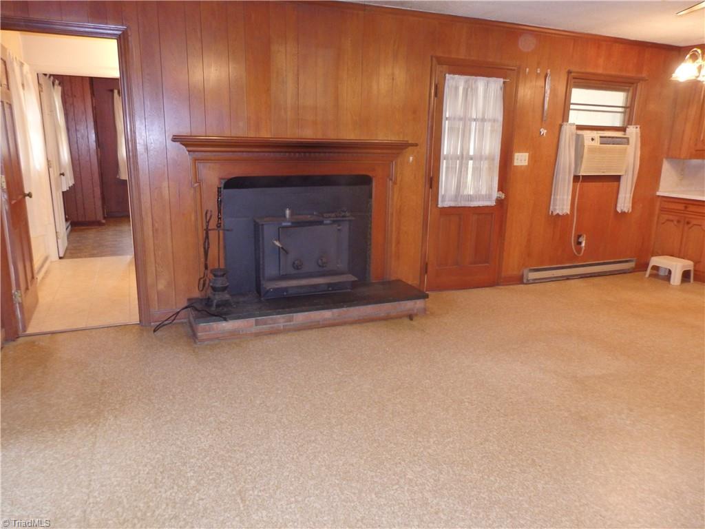 1018 Sutton Road Greensboro, NC 27406 - Photo 10 of 47 Den with wood burning fireplace insert