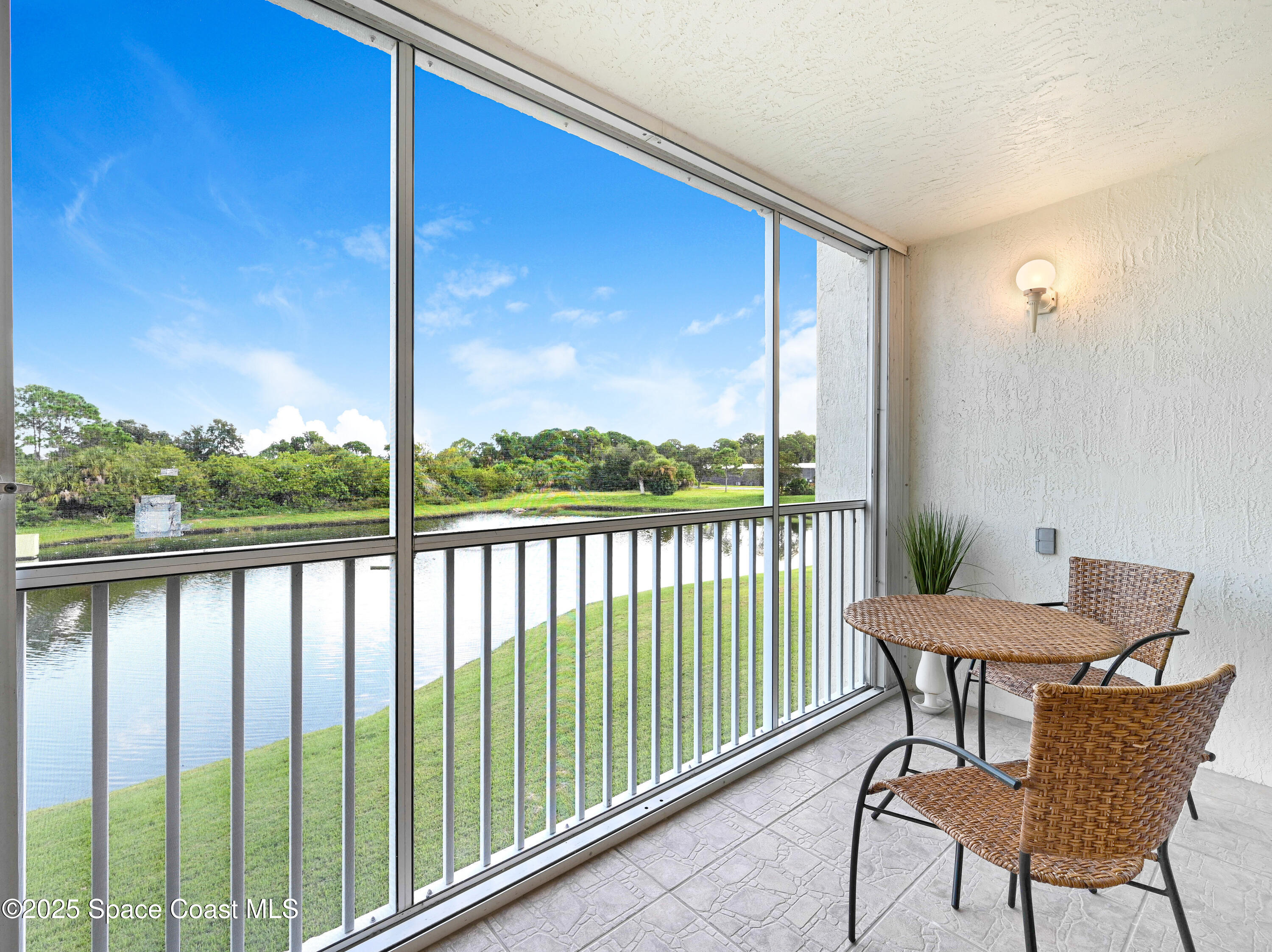 1410 Huntington Lane, Unit 1203 Rockledge, FL 32955 - Photo 11 of 46 Enclosed Porch w/Hurricane Shutters