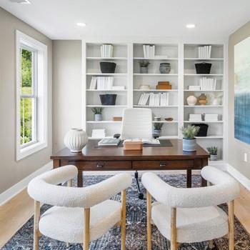 5111 Teaberry Lane, Unit 1 Fishkill, NY 12524 - Photo 5 of 7 a view of a dining room with furniture and a book shelf