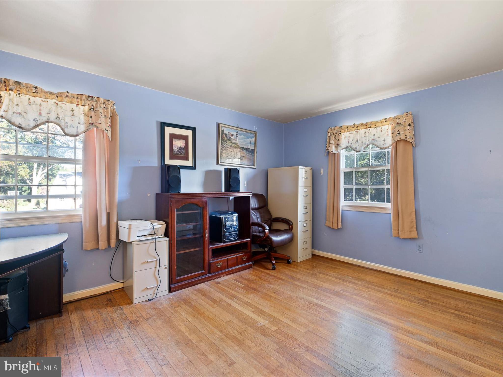 133 Marcella Road Wilmington, DE 19803 - Photo 21 of 27 a room with furniture a flat screen tv and a window